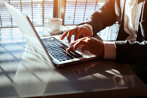 Person typing on a laptop